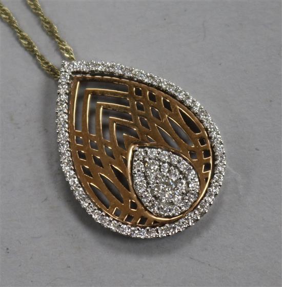 An 18ct gold and diamond set pear shaped pendant on chain, pendant 24mm.